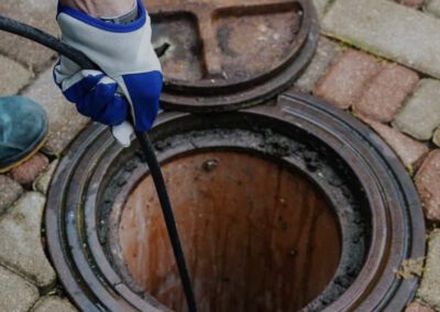 Inspection of sewer with pipe by man